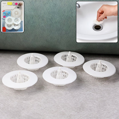Five white plastic sink drain strainers are on a gray surface, with a product packaging inset and a sink use inset