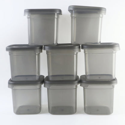 Eight empty, clear plastic food storage containers with gray lids, arranged in a grid on a white background.