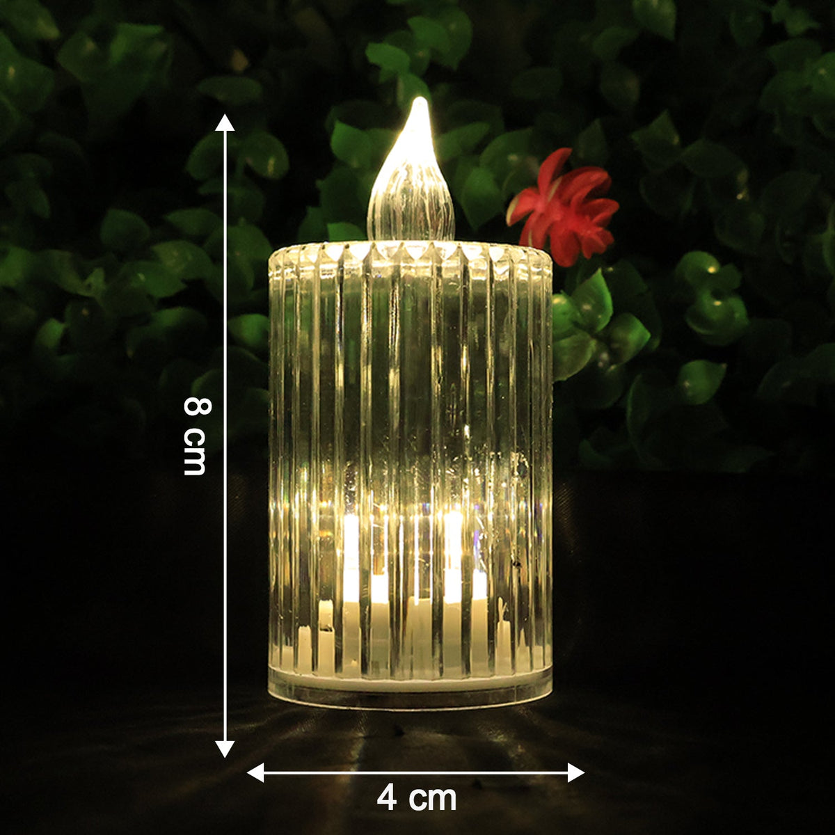 A single clear ribbed LED flameless candle with warm glow, measuring 8 cm tall and 4 cm wide.