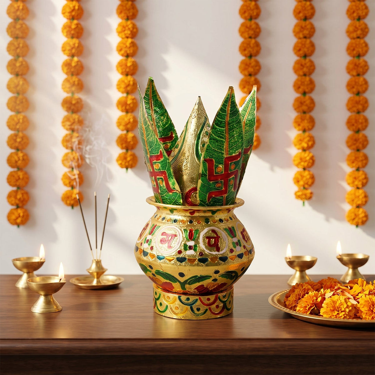 A golden metal Kalash with green leaves, incense, and lamps on a wooden surface.