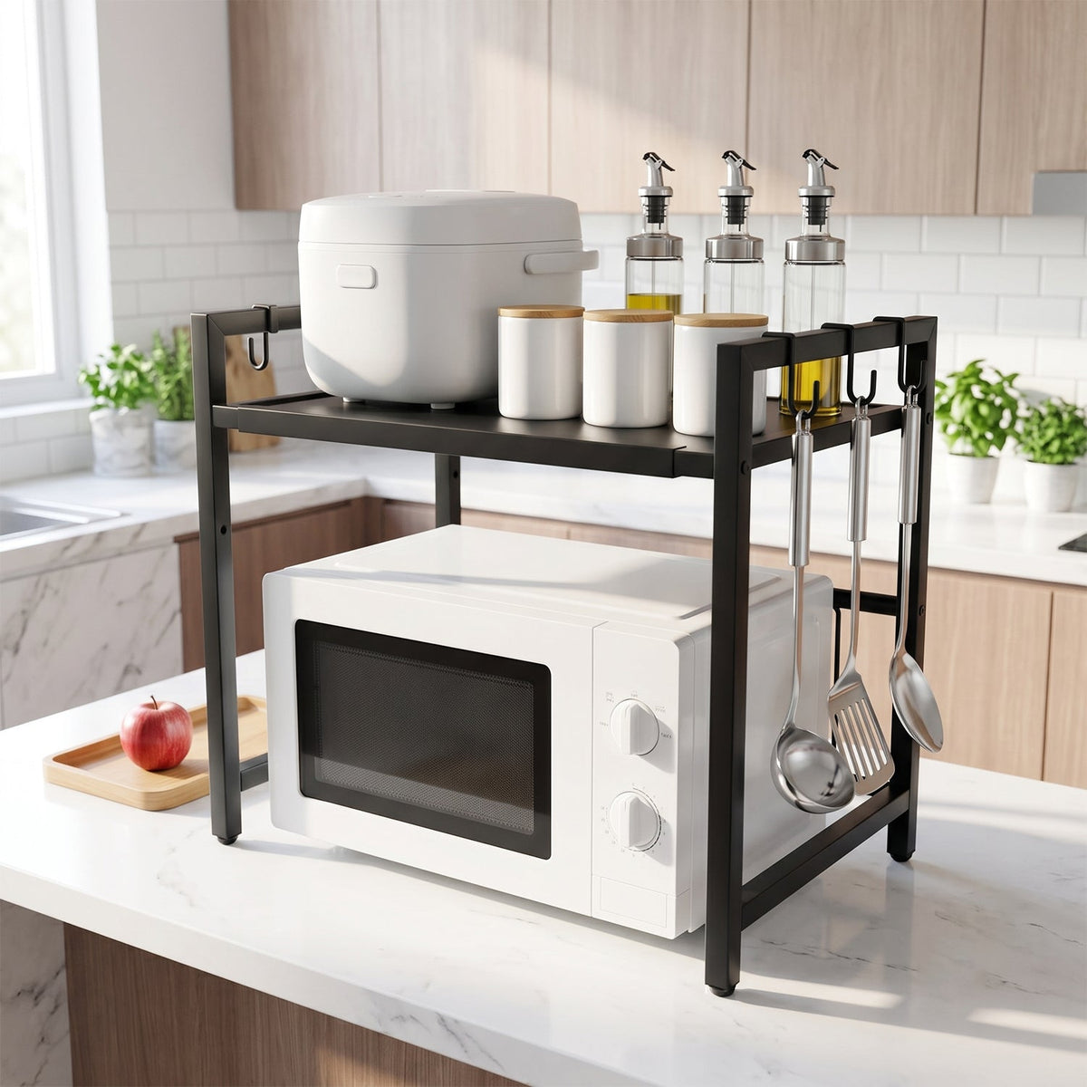 White microwave on a black metal rack with a rice cooker, jars, and utensils, in a modern kitchen setting.