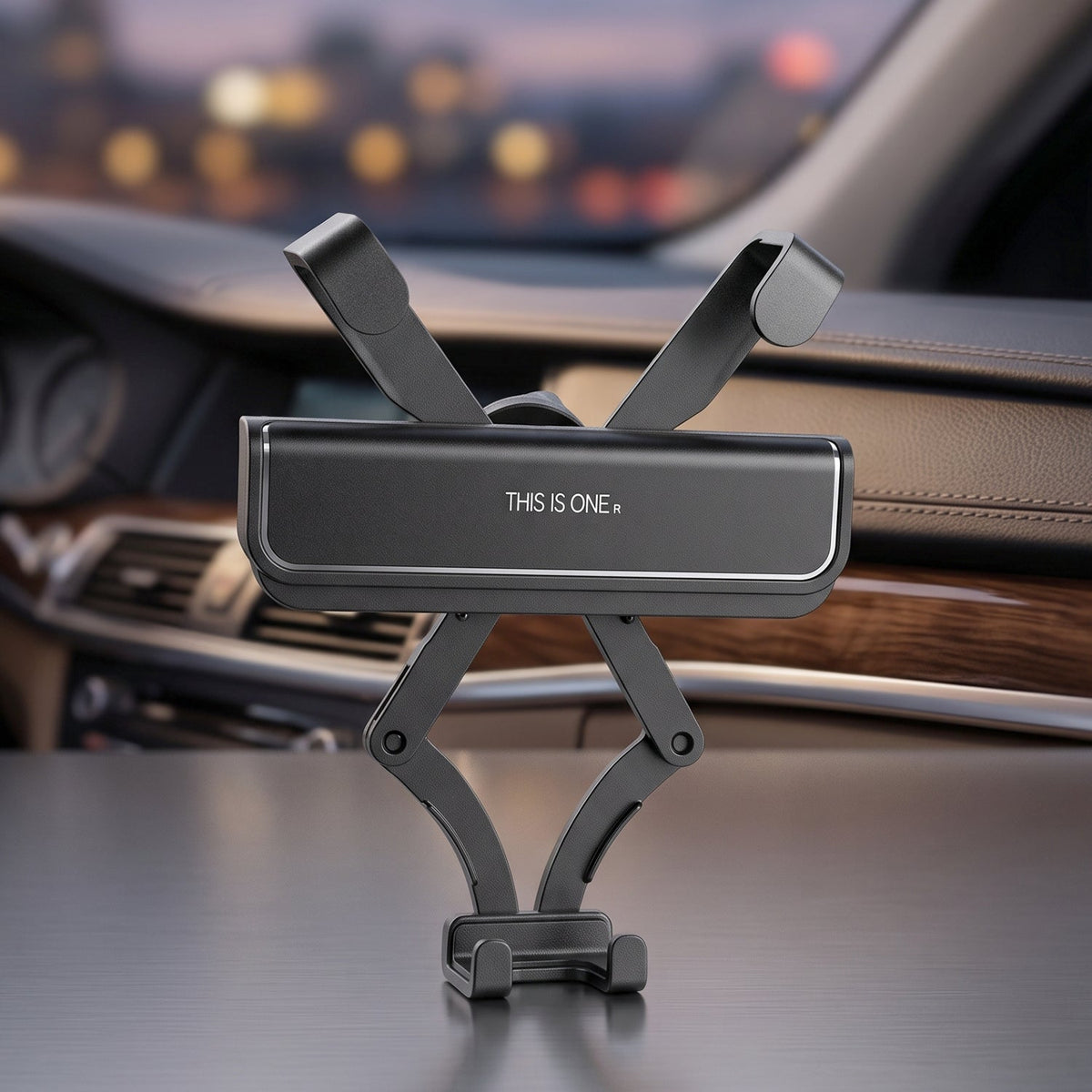 A black car phone holder with an extendable arm mechanism, sitting on a car dashboard at night