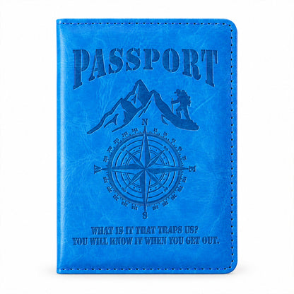 Front view of the closed blue passport holder with an embossed mountain, compass, and text design.