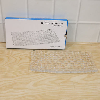Clear glass rectangular serving tray with a basketweave design, next to its blue and white product box.
