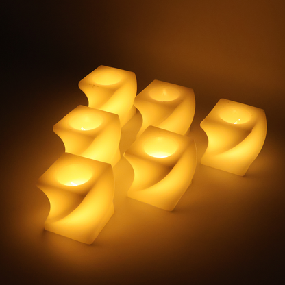 Six cream-colored flameless LED candles with a twisted design glow warmly in a dark setting.