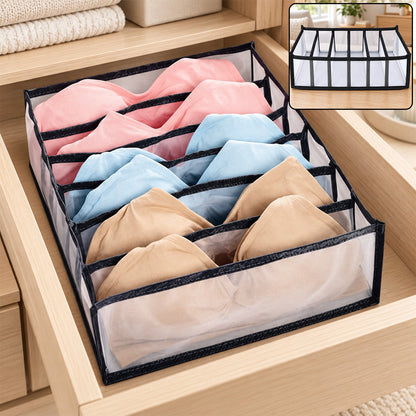 A 6-section drawer organizer filled with pink, blue, and beige bras sits inside a light wooden drawer. – view 8