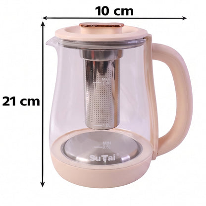 The light pink and clear glass electric kettle with a metal infuser sits on its base, plugged in, on a wooden surface.