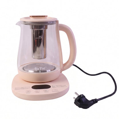 A person pours clear, steaming water from the glass kettle into a teacup, with the light pink base beside it on a table.
