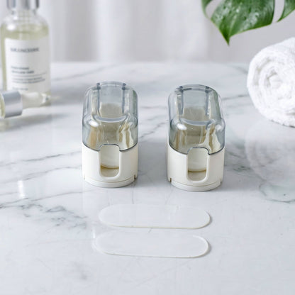 Toothbrush holder mounted on a bathroom wall