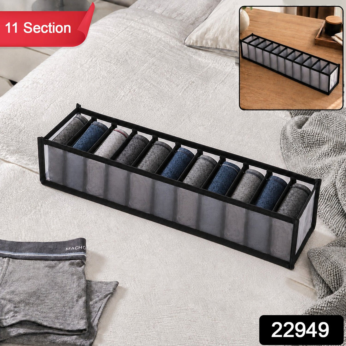 A gray 11-section fabric organizer with rolled socks on a white bedspread, with a red "11 Section" label and a black "22949"