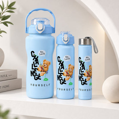 Three light blue water bottles of varying sizes with a teddy bear graphic and text on a white shelf.