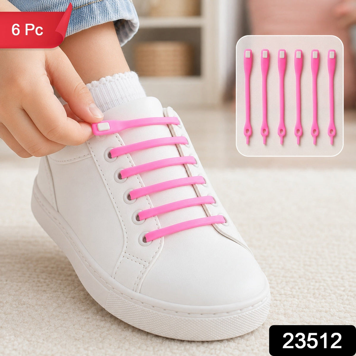 A child's foot in a white sneaker with pink silicone no-tie shoelaces, with a "6 Pc" label and product number 23512.