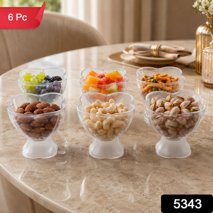 Six clear plastic dessert bowls filled with snacks and fruits on a marble table, with a red 6 Pc label.
