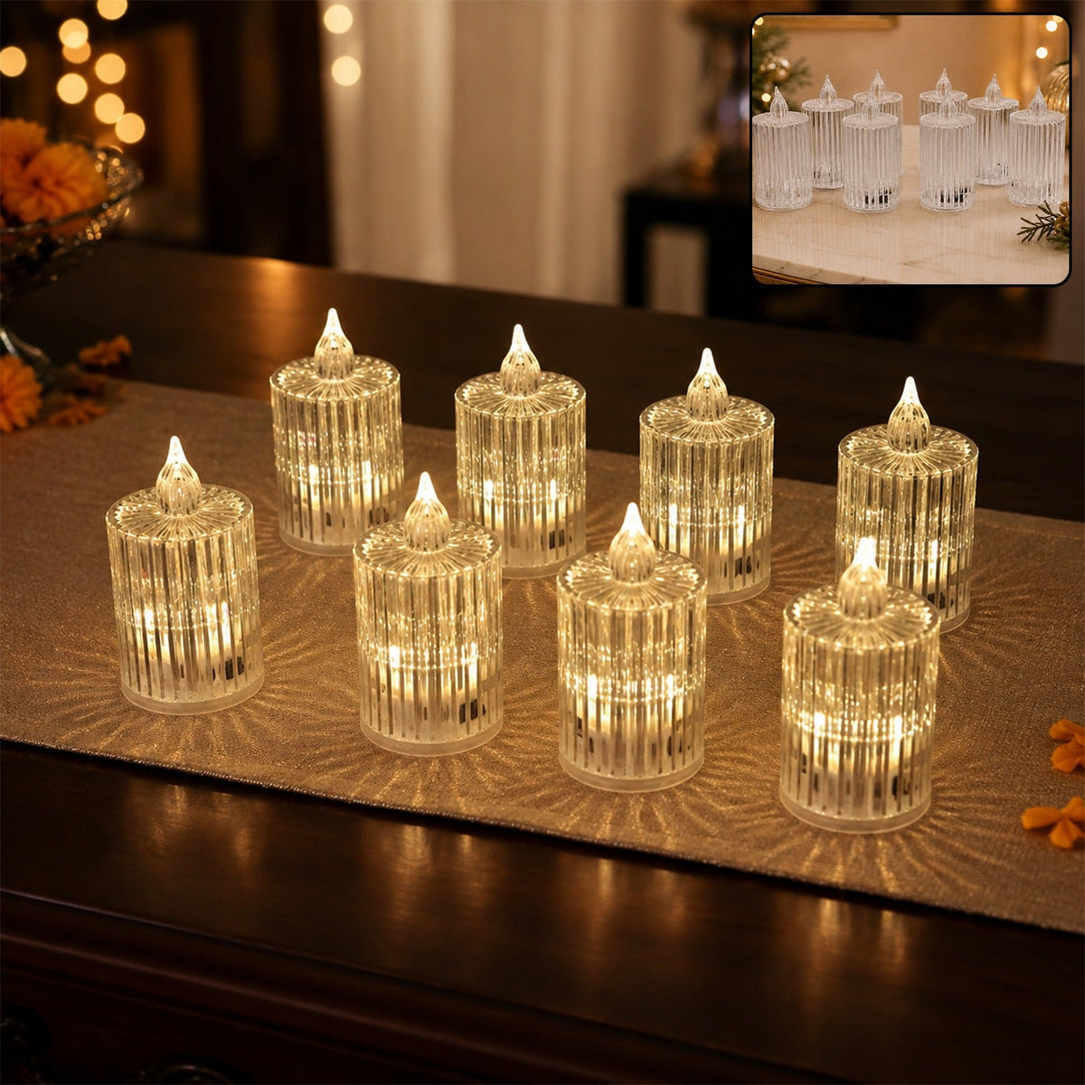 Eight clear ribbed LED flameless candles with warm glow arranged on a table runner in a dimly lit room.