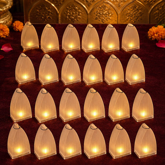 Twenty-four transparent arch stripe LED candles arranged in rows on a red fabric surface with gold and orange accents in the