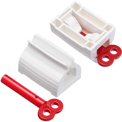 Two white plastic tube squeezers and a detached red winding key are displayed on a white background.