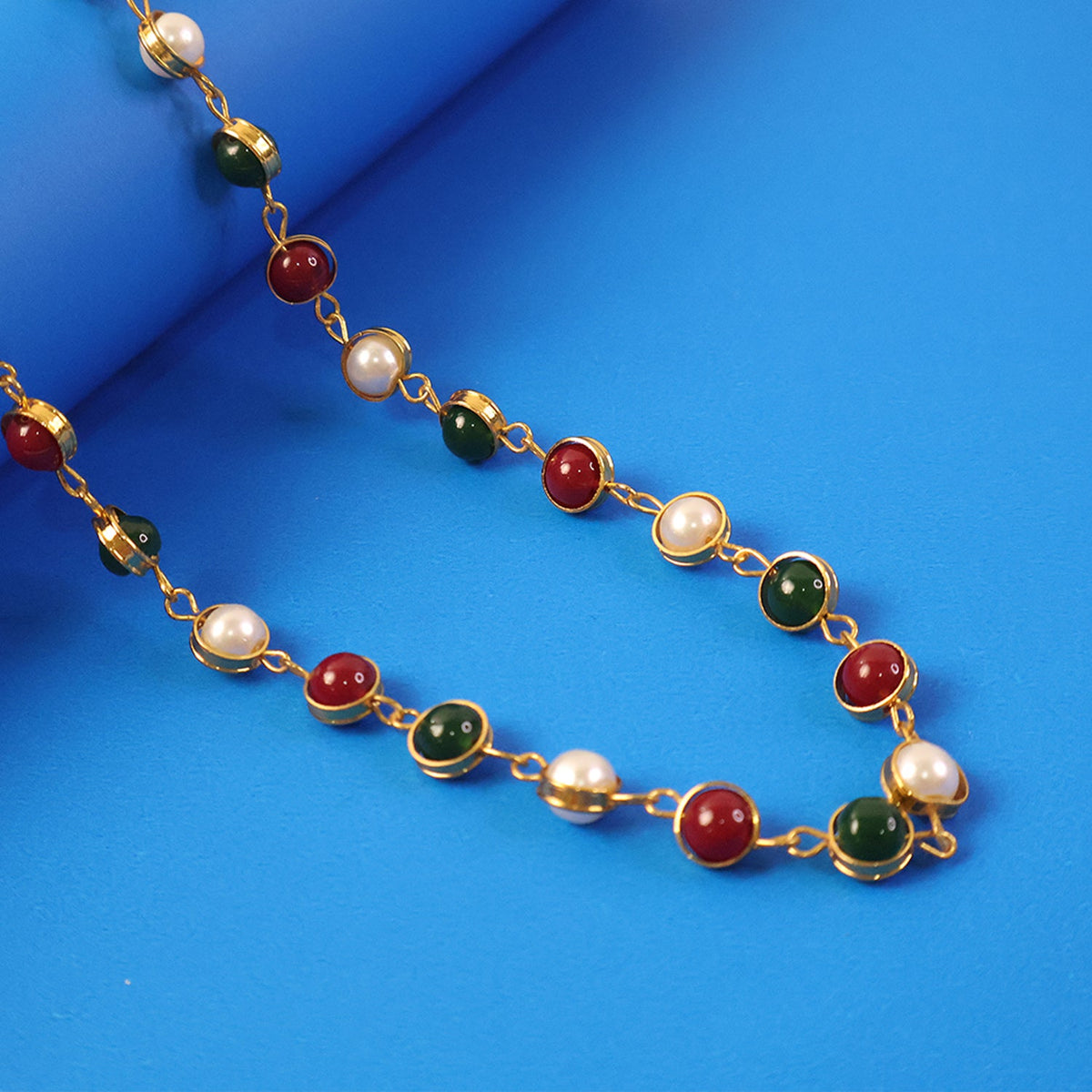 Pearl and stone necklace with gold finish chain showcasing ethnic design