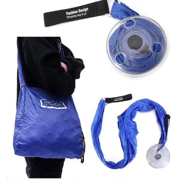 A person carries a blue reusable shopping bag. The bag's dispenser and a partially unrolled bag are shown separately.