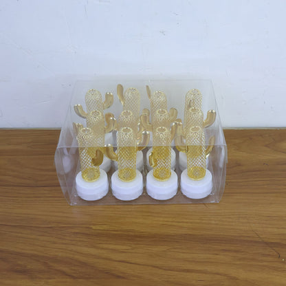 Decorative cactus shaped flameless LED candles lit up adding ambient lighting to a setting