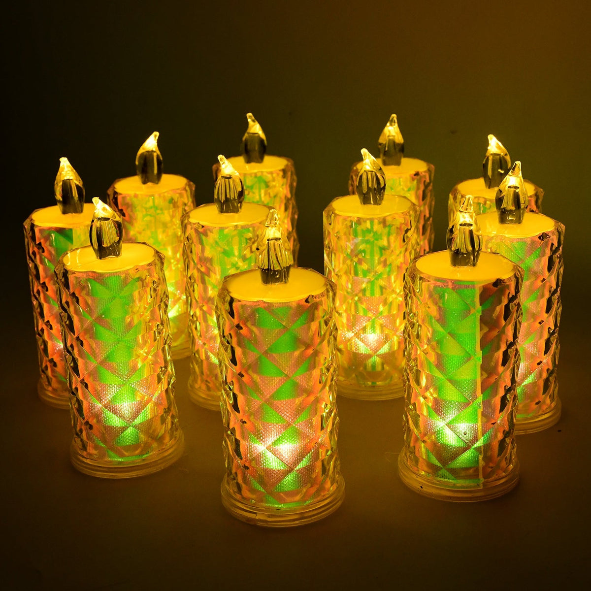Ten iridescent LED candles with textured surfaces glow with a green and yellow light, arranged on a dark surface.