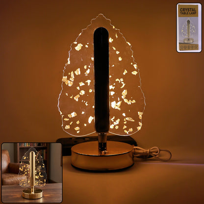 A golden crystal leaf LED table lamp with gold flakes, a small inset image of the lamp, and a remote control.