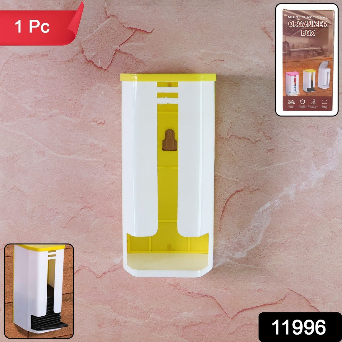 A white and yellow plastic bag dispenser is mounted on a pinkish-brown textured wall.