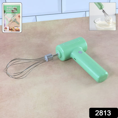 Light green cordless electric whisk on a brown counter; an inset shows the whisk in use and a product label.
