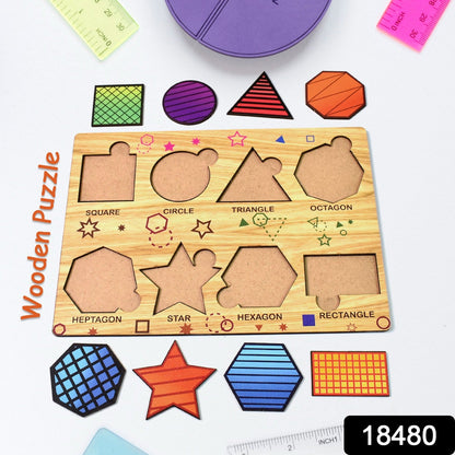 A wooden shape sorting puzzle board with colorful geometric pieces scattered around it on a white surface.