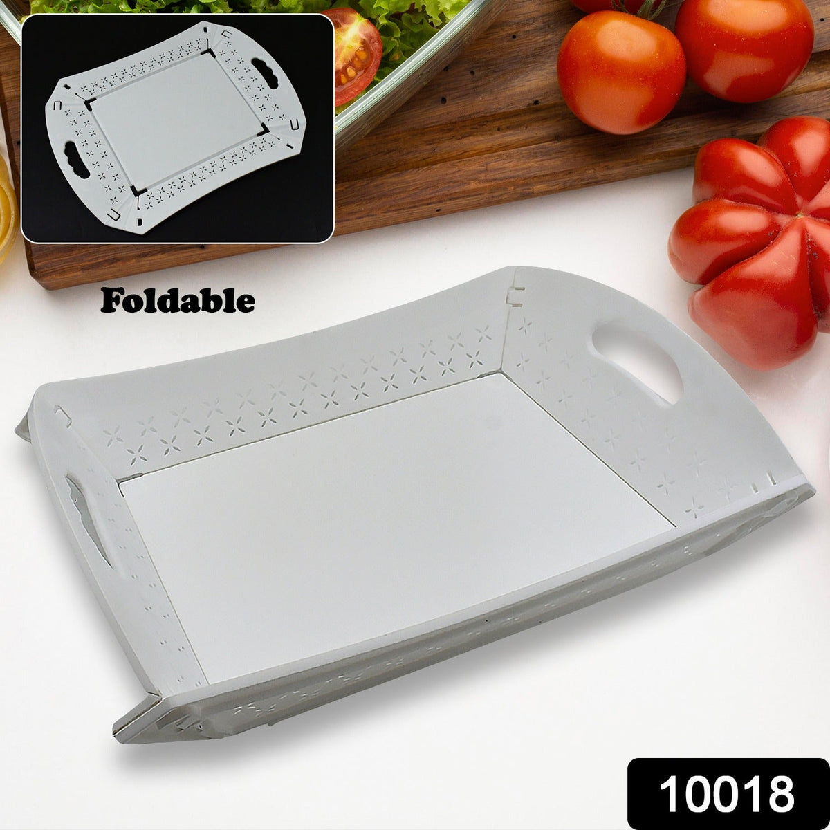 A white foldable serving tray is shown partially folded, with vegetables in the background.