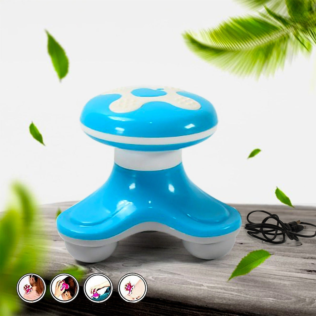 A blue and white handheld body massager with three rolling feet sits on a wooden surface with green leaves.