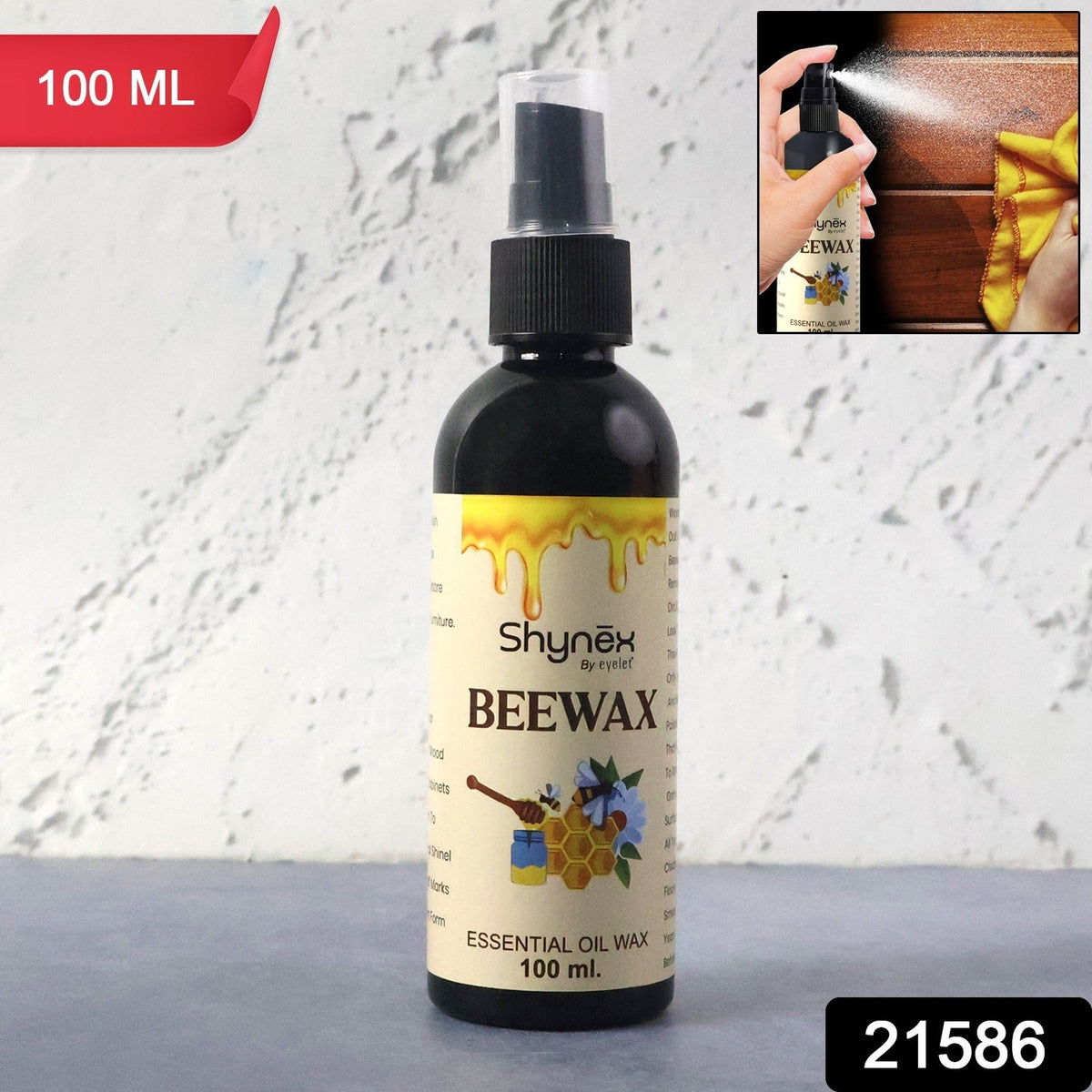 A 100ml black spray bottle of Shynex Beeswax polish with a honey-themed label stands against a white background.