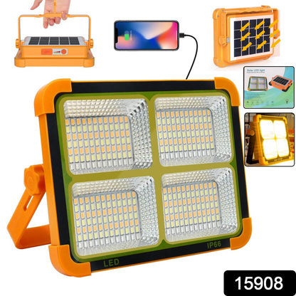 Orange and black solar LED flood light with four illuminated panels, shown with a phone charging and solar panel detail.