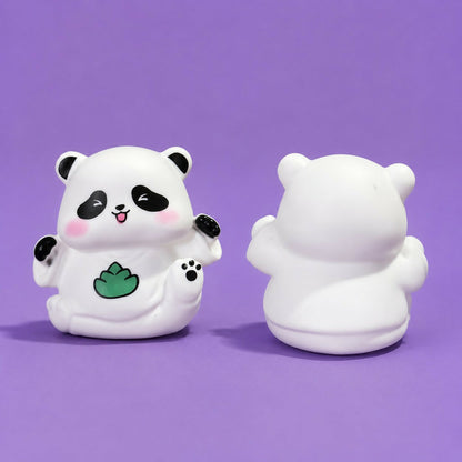 A front and back view of the white panda night light, showing its detailed face and smooth, unadorned rear surface on a