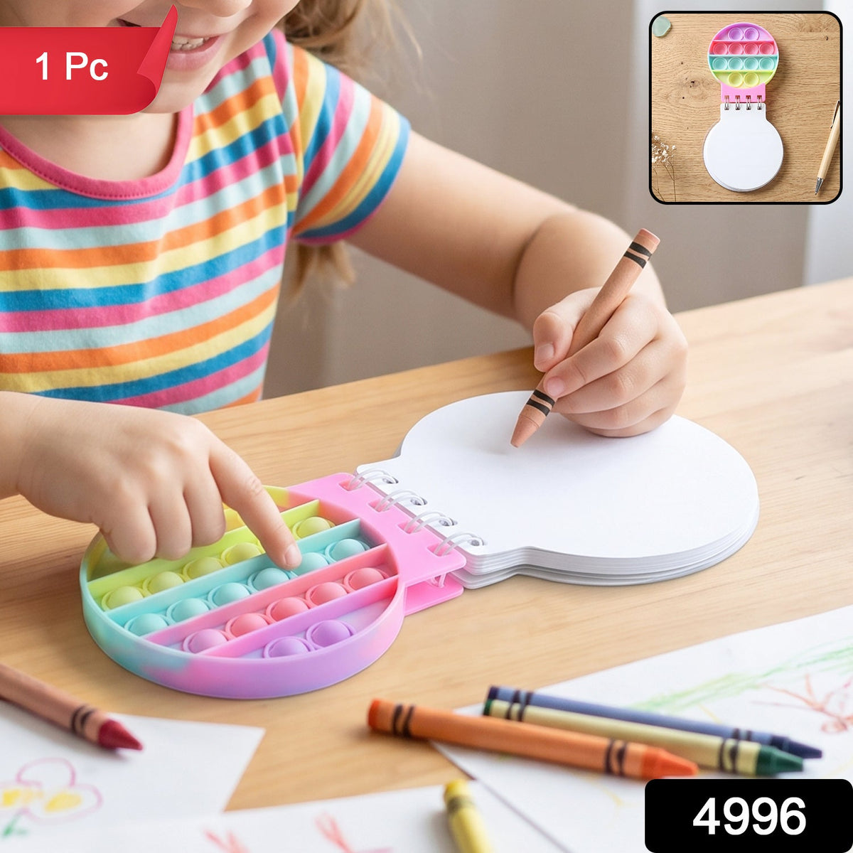 A child's hands interact with a rainbow pop-it fidget notebook, one hand pressing bubbles, the other holding a – view 2