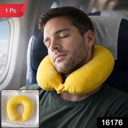 A sleeping man on an airplane wears a yellow neck pillow; a small inset shows the pillow on a white surface.