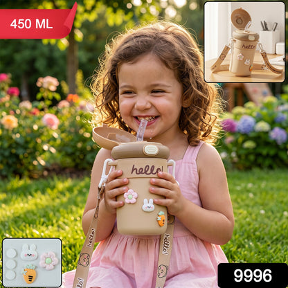 A smiling child holds a tan sipper bottle with a straw and cute animal and flower charms, with 450 ML and 9996 text overlays.
