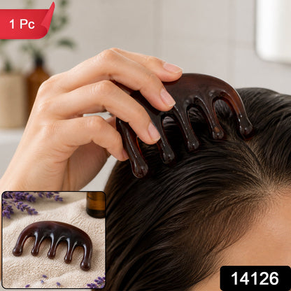 A woman's hand uses a dark brown resin scalp massager on her wet hair, with a smaller inset image of the massager – view 2