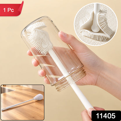 A hand holds a clear glass bottle being cleaned by a white silicone brush, with a close-up of the brush head and a red '1