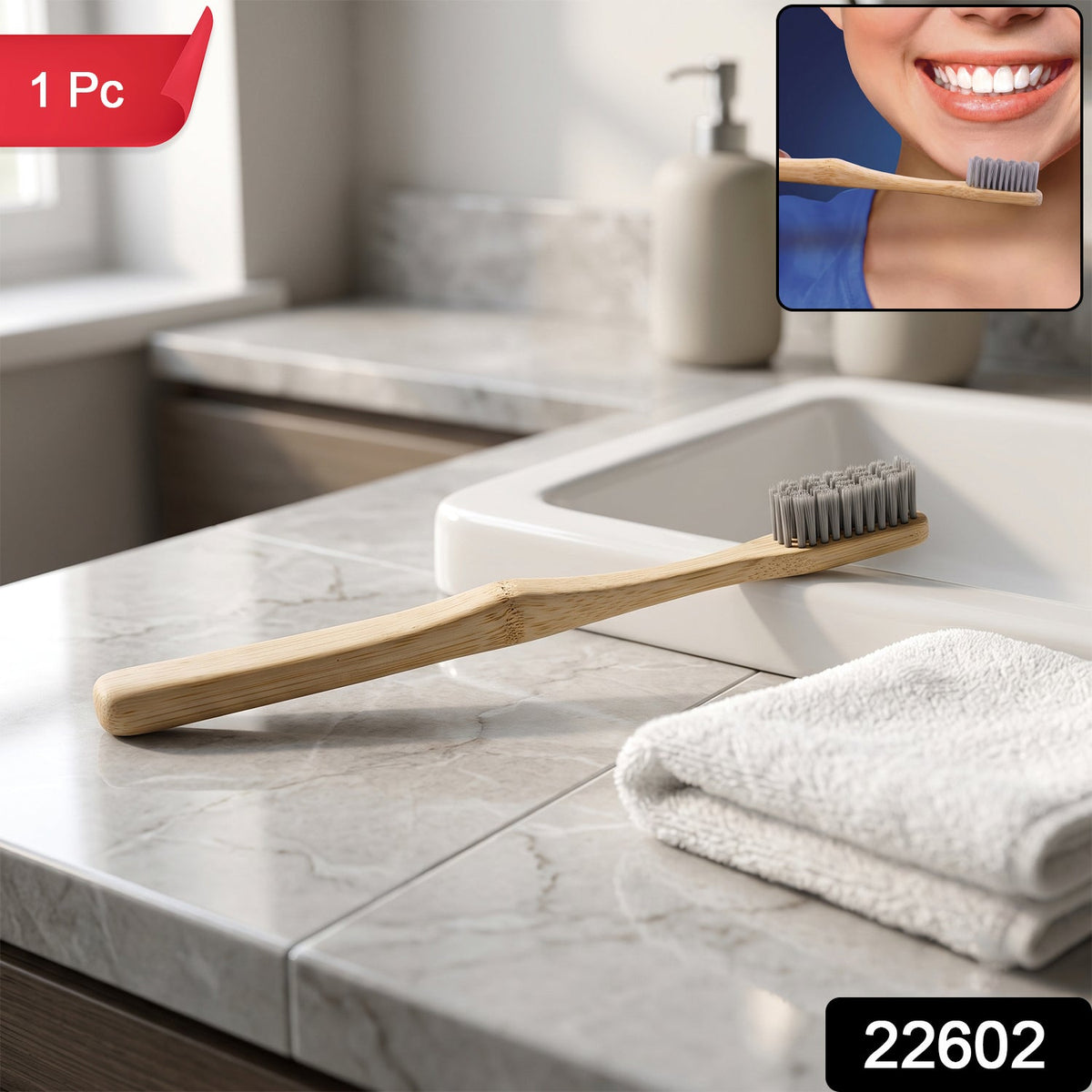 A bamboo toothbrush with grey bristles rests on a marble counter next to a white sink and folded towel, with a – view 2