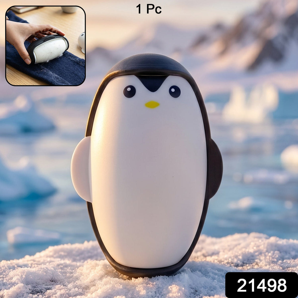 A black and white penguin lint roller stands on a snowy surface with icebergs and mountains in the background.