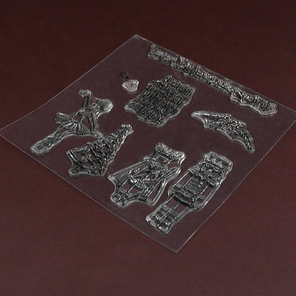 A close-up of the clear silicone stamp sheet, showcasing the detailed designs on a dark brown surface.